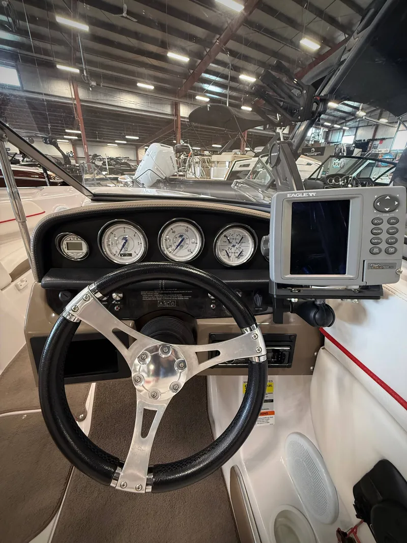 Slide: The Image of Interior view of 2007 Four Winns 210 Horizon boat cockpit. - 11