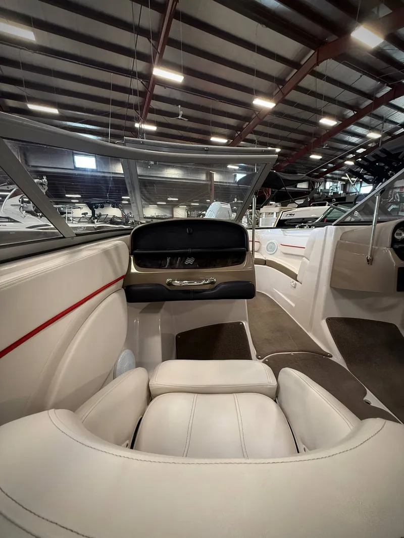 Slide: The Image of Interior of a 2007 Four Winns 210 Horizon boat in a warehouse. - 13
