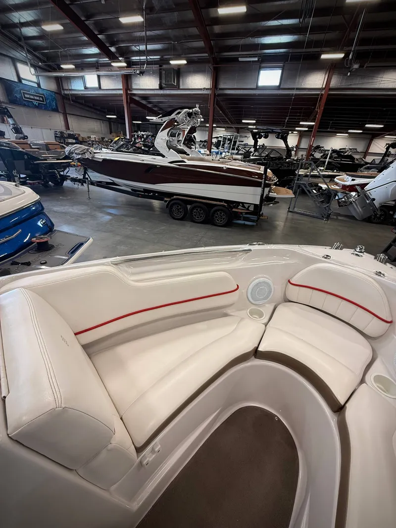 Slide: The Image of Interior view of a 2007 Four Winns 210 Horizon boat in a warehouse. - 14