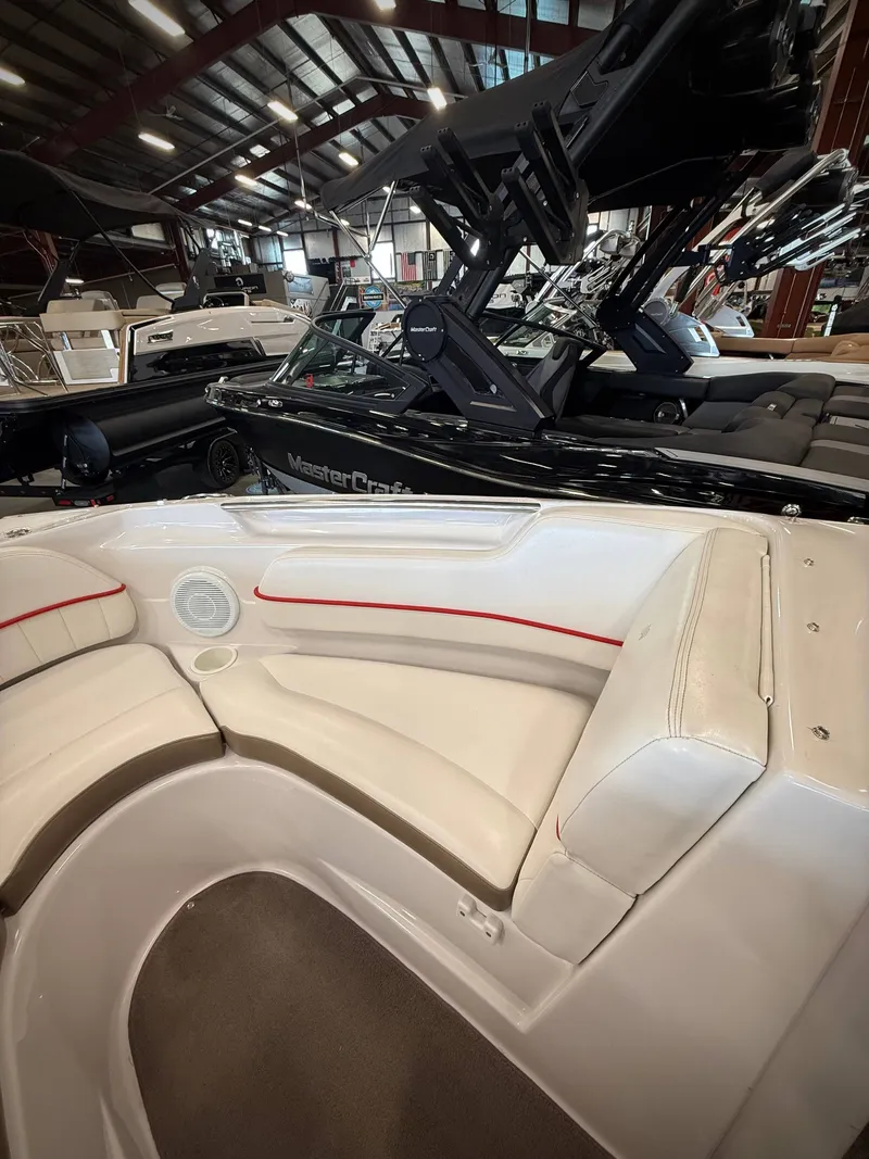 Slide: The Image of Interior view of a 2007 Four Winns 210 Horizon boat in showroom. - 15