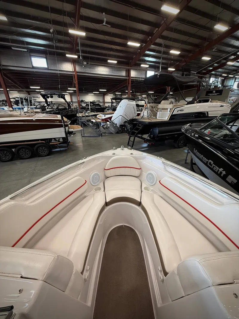 Slide: The Image of Interior view of a 2007 Four Winns 210 Horizon boat in showroom. - 16