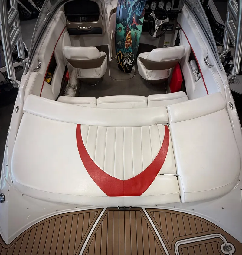 Slide: The Image of Interior of a 2007 Four Winns 210 Horizon boat with white and red seating. - 4