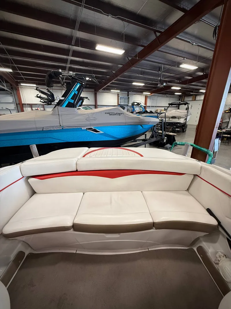 Slide: The Image of Interior view of a 2007 Four Winns 210 Horizon boat in a storage facility. - 6