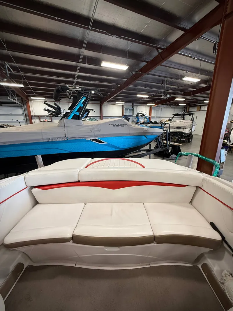 Slide: The Image of Interior view of a 2007 Four Winns 210 Horizon boat in a storage facility. - 7