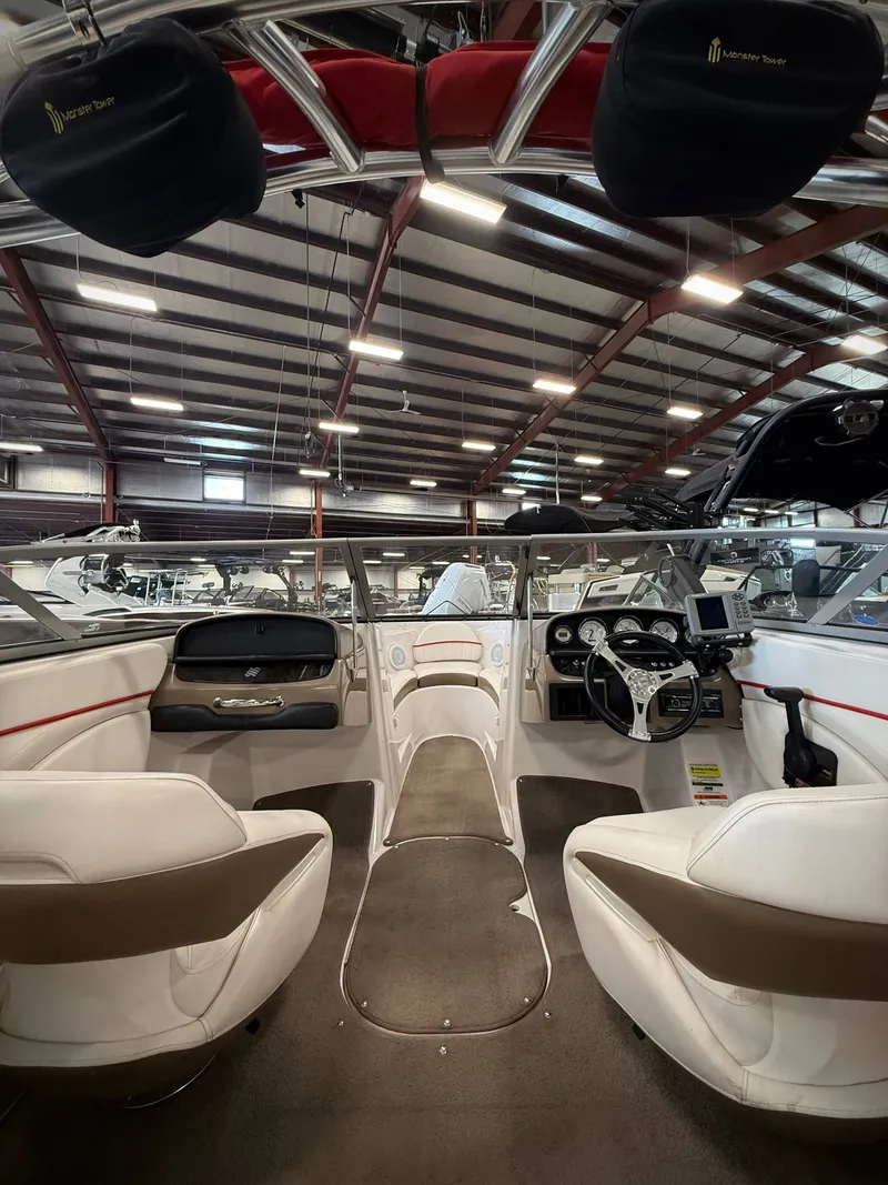 Slide: The Image of Interior view of a 2007 Four Winns 210 Horizon boat in a storage facility. - 9
