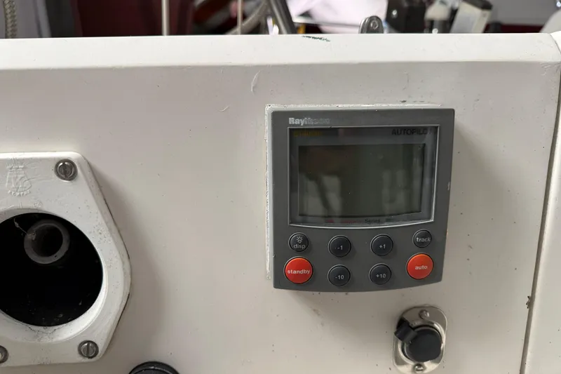 Slide: The Image of Control panel of a 1986 CAL 33 sailboat featuring a Raytheon autopilot system. - 10