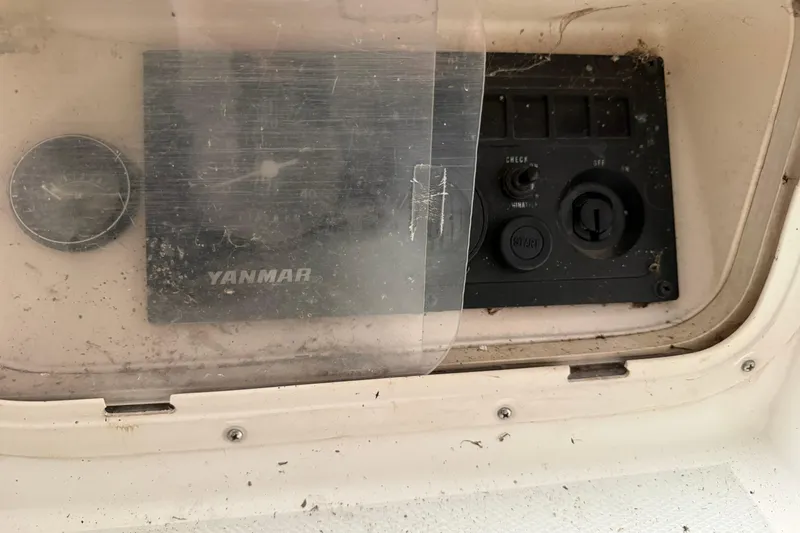 Slide: The Image of Control panel of a 1986 CAL 33 sailboat with Yanmar engine components. - 11