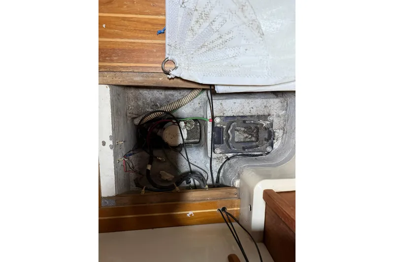 Slide: The Image of Electrical compartment of a 1986 CAL 33 sailboat, showing wiring and components. - 27