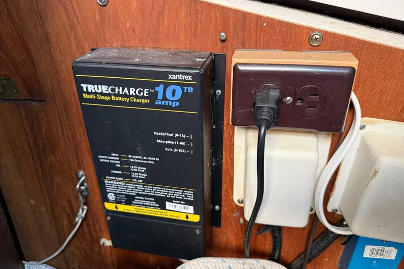 Slide: The Image of Xantrex TrueCharge 10 amp battery charger installed on a CAL 33, 1986 model. - 34
