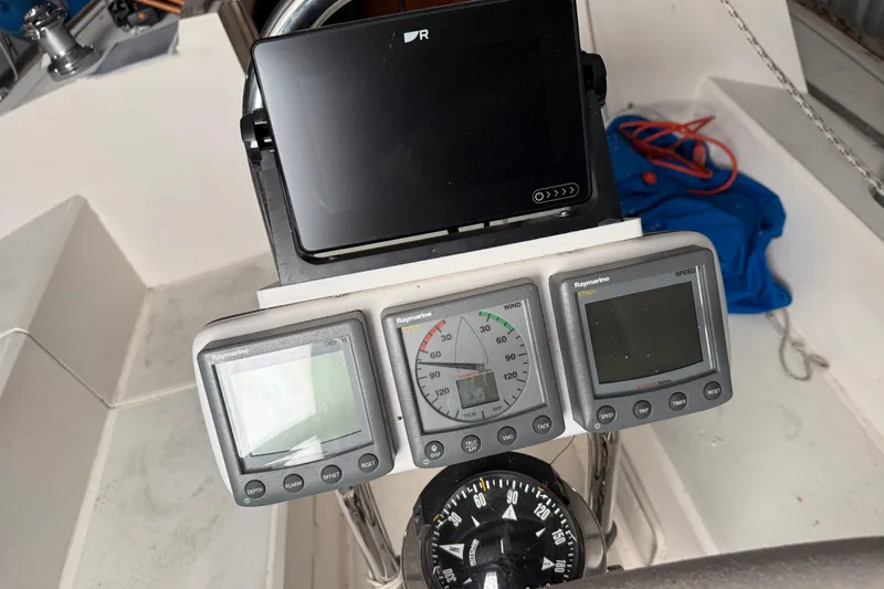 Slide: The Image of Cockpit of 1986 CAL 33 sailboat with navigation instruments and compass. - 7