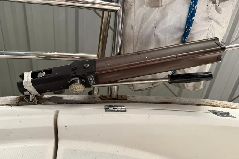 Slide: The Image of Close-up of a 1986 CAL 33 boat's steering mechanism with a Navtec hydraulic backstay adjuster. - 9