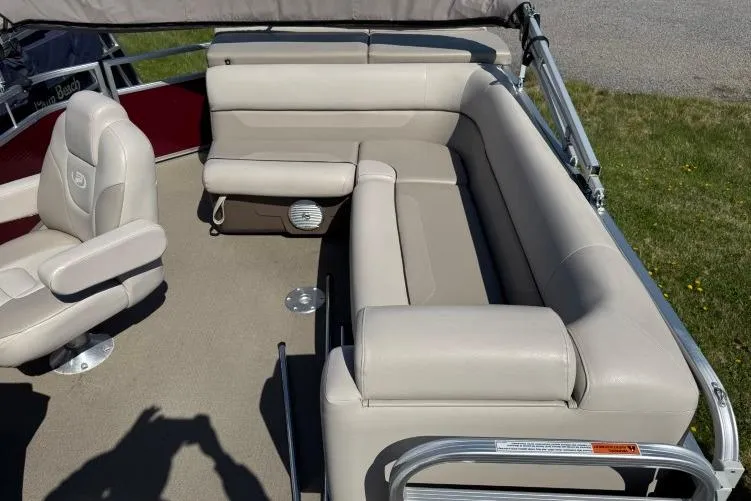 Slide: The Image of 2016 Princecraft Vectra 21 pontoon boat interior with beige seating and carpet. - 8