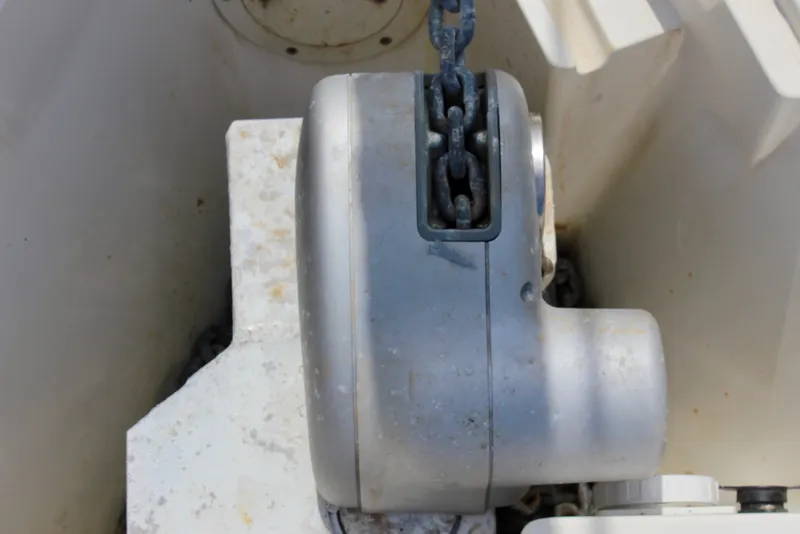 Slide: The Image of Anchor windlass on 1989 Catalina 36 sailboat, showcasing chain mechanism. - 12