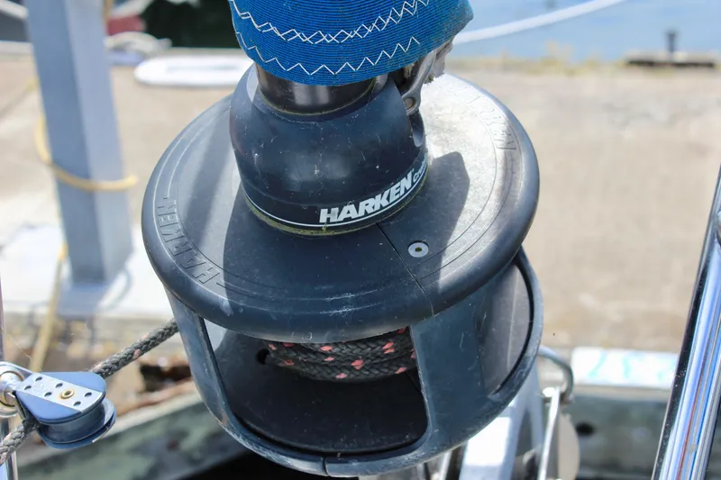 Slide: The Image of Harken winch on 1989 Catalina 36 sailboat, docked with visible rigging. - 13