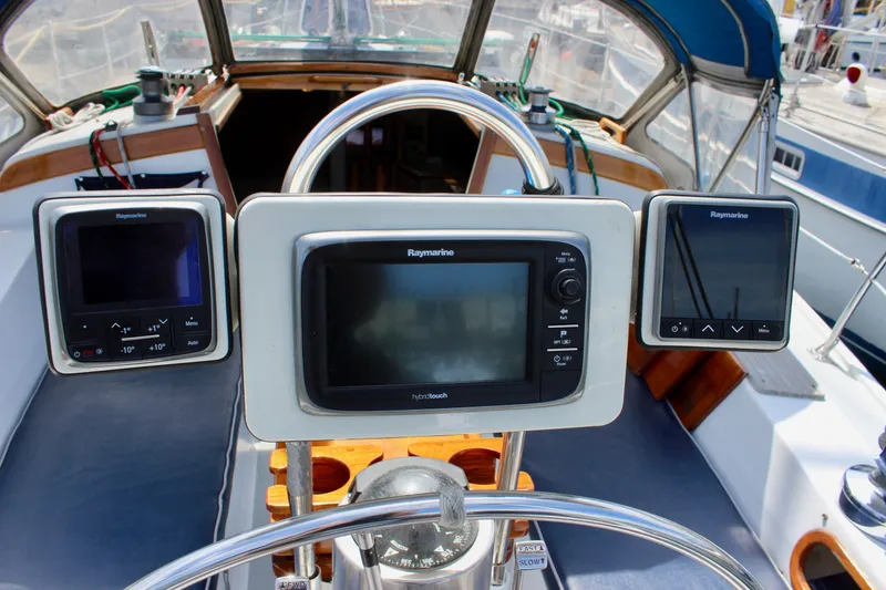 Slide: The Image of Cockpit of 1989 Catalina 36 sailboat with Raymarine navigation displays. - 23