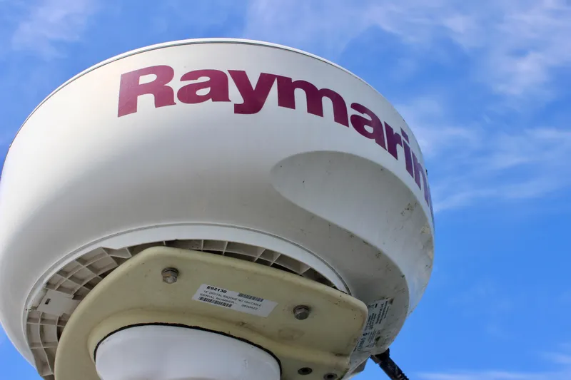 Slide: The Image of Raymarine radar on 1989 Catalina 36 sailboat against blue sky. - 25