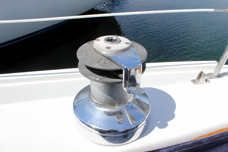 Slide: The Image of Winch on 1989 Catalina 36 sailboat deck, near water. - 26