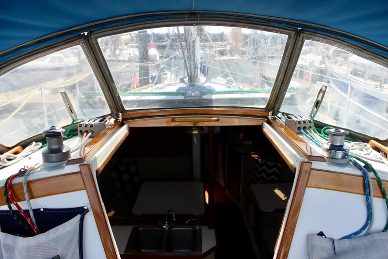 Slide: The Image of Cockpit view of a 1989 Catalina 36 sailboat, showcasing winches and ropes. - 28