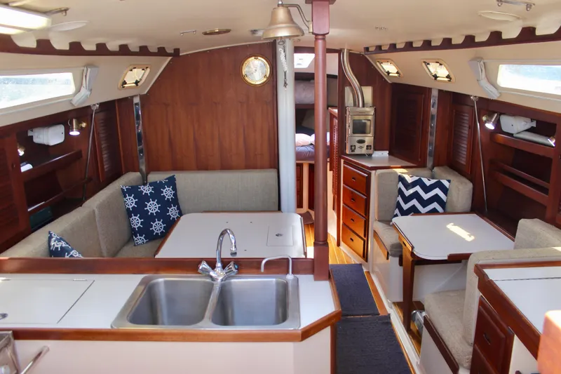 Slide: The Image of Interior of a 1989 Catalina 36 sailboat with cozy seating and nautical decor. - 30
