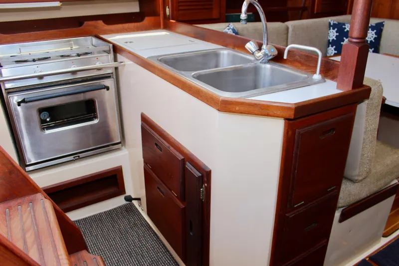 Slide: The Image of Galley kitchen in 1989 Catalina 36 sailboat with stainless steel sink and stove. - 32