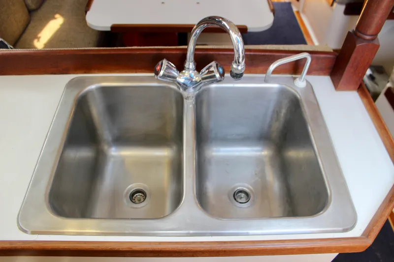 Slide: The Image of Double stainless steel sink in 1989 Catalina 36 yacht kitchen area. - 33