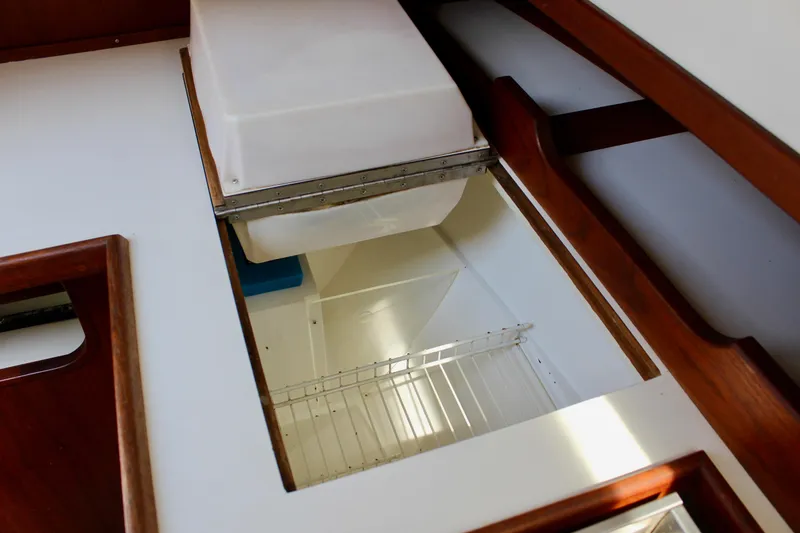 Slide: The Image of Interior view of a 1989 Catalina 36 sailboat's storage compartment. - 35