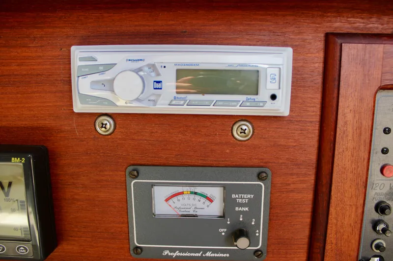 Slide: The Image of Control panel of a 1989 Catalina 36 sailboat with stereo and battery gauge. - 40