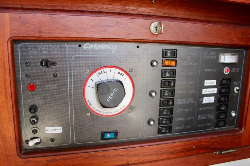 Slide: The Image of Electrical control panel of a 1989 Catalina 36 sailboat with switches and labels. - 41