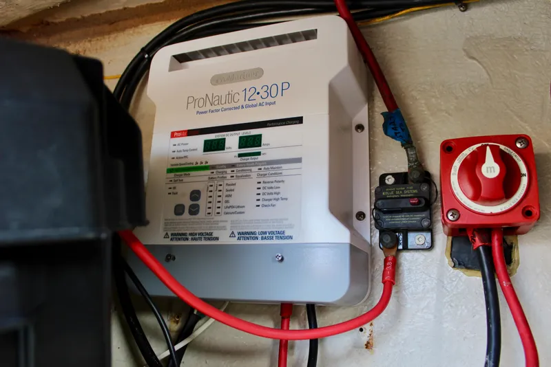 Slide: The Image of ProNautic 12-30P charger in 1989 Catalina 36 boat, with wiring and switch. - 58