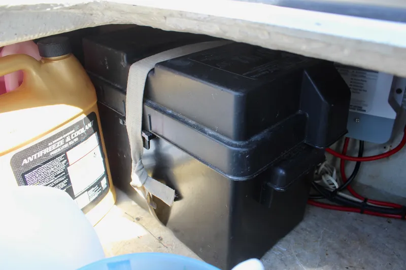 Slide: The Image of Battery compartment and antifreeze container in a 1989 Catalina 36 sailboat. - 59