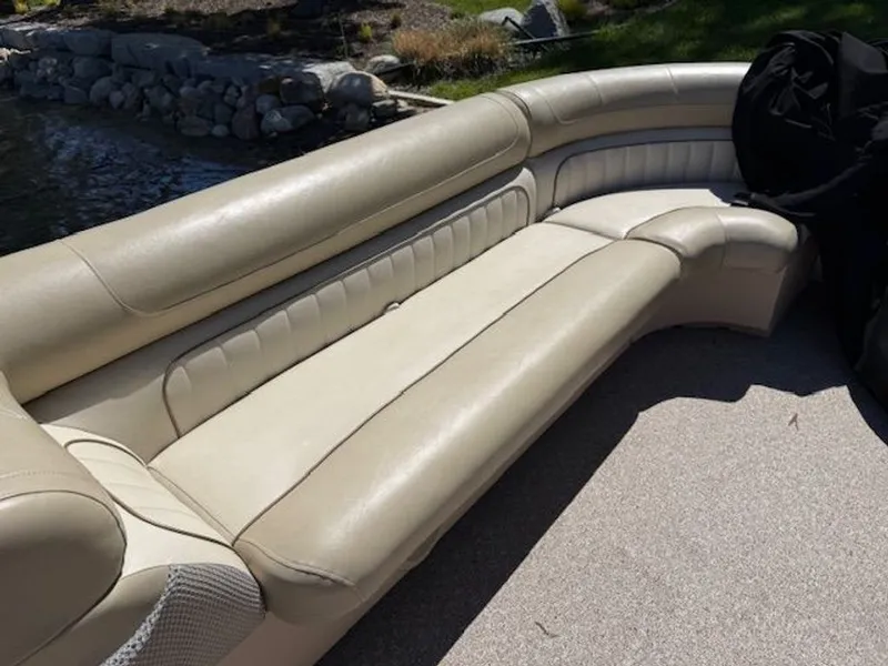 Slide: The Image of Beige leather seating on a 2011 Cypress Cay 220 Cabana boat. - 10