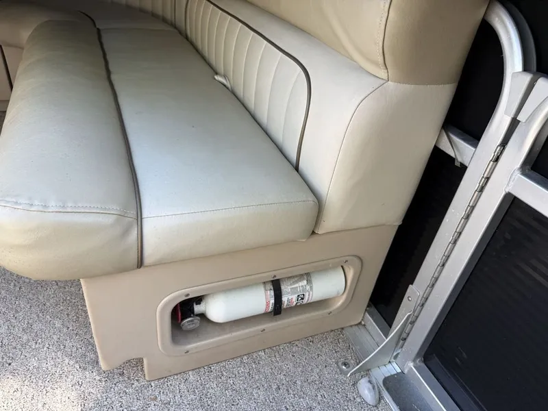Slide: The Image of Cypress Cay 220 Cabana seat with fire extinguisher, year 2011. - 12