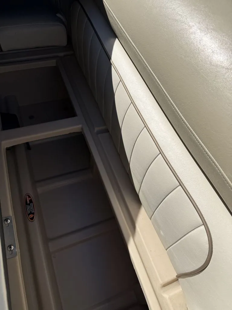 Slide: The Image of Interior of a 2011 Cypress Cay 220 Cabana boat with seat cushion. - 13