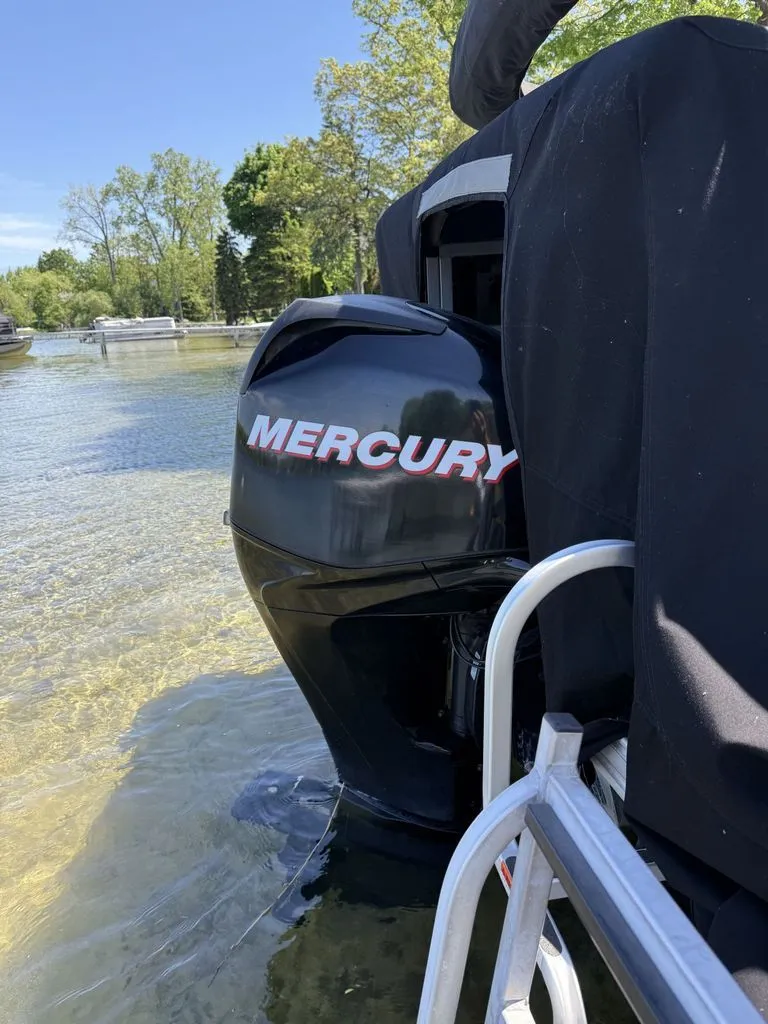 Slide: The Image of Mercury outboard motor on a 2011 Cypress Cay 220 Cabana boat. - 21