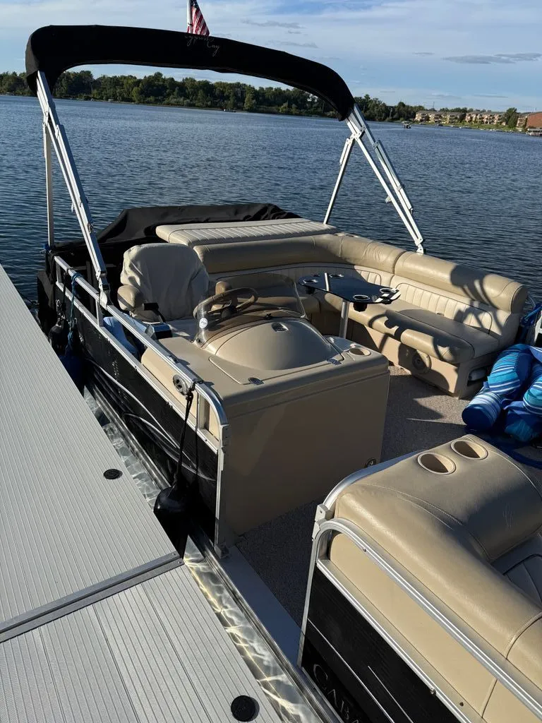 Slide: The Image of 2011 Cypress Cay 220 Cabana pontoon boat on a lake. - 4