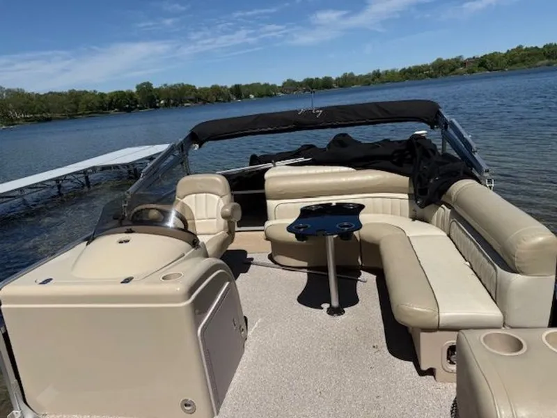 Slide: The Image of 2011 Cypress Cay 220 Cabana pontoon boat on a serene lake. - 5