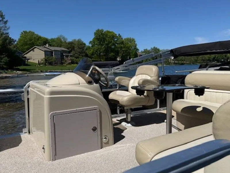 Slide: The Image of 2011 Cypress Cay 220 Cabana pontoon boat on a serene lake. - 6