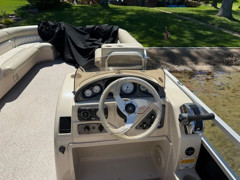 Slide: The Image of Helm console of a 2011 Cypress Cay 220 Cabana pontoon boat. - 7