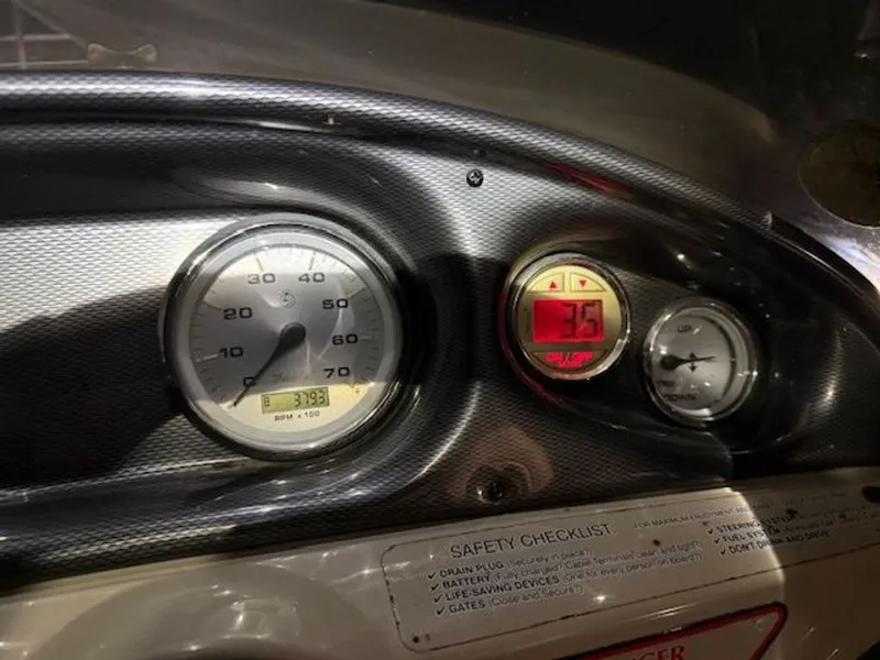 Slide: The Image of Dashboard of a 2011 Cypress Cay 220 Cabana boat. - 8