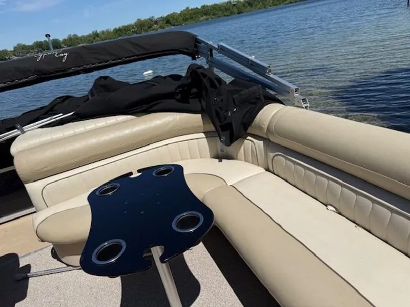 Slide: The Image of Cypress Cay 220 Cabana 2011 with beige seating area on a lake. - 9
