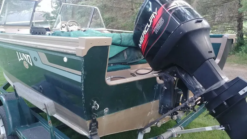 Slide: The Image of 1998 Lund 1900 Tyee boat with Mercury 125 outboard motor. - 4