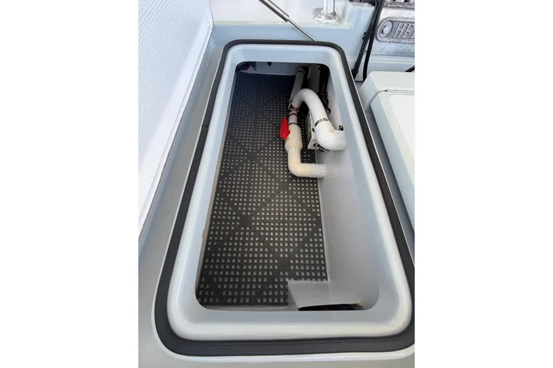 Slide: The Image of 2020 Hells Bay Professional boat compartment with plumbing and Livewell drainage system. - 12