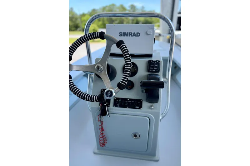 Slide: The Image of Steering console of a 2020 Hells Bay Professional boat with Simrad equipment. - 2