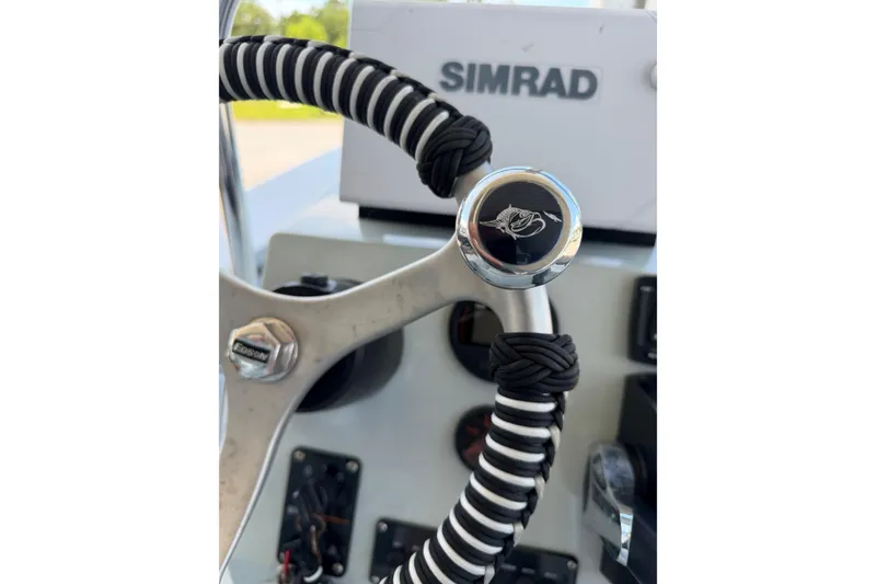 Slide: The Image of Edson Custom Wrapped Steering Wheel 2020 Hells Bay Professional , New Simrad navigation system. - 5