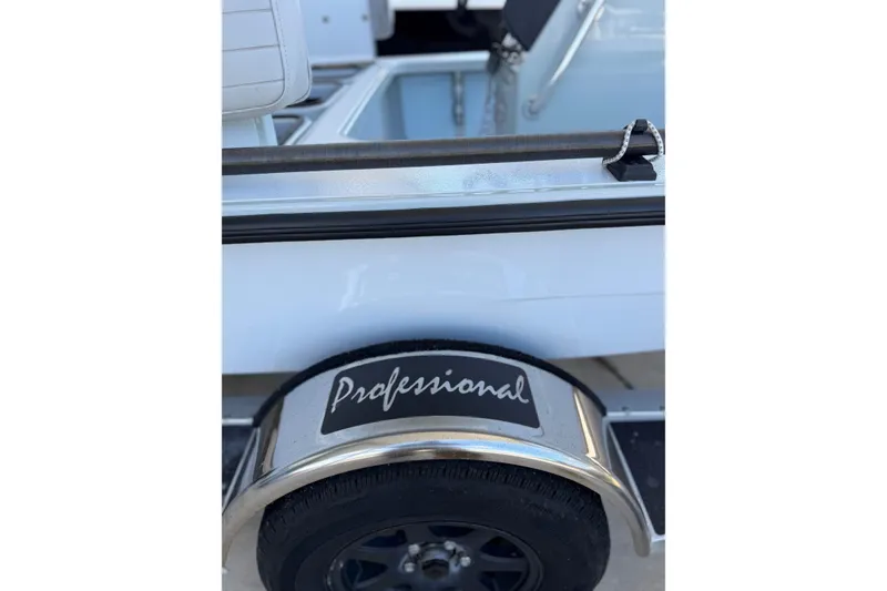 Slide: The Image of 2020 Hells Bay Professional boat trailer with "Professional" branding on the fender. - 9