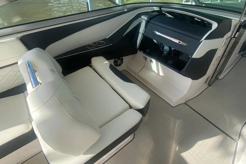 Slide: The Image of Luxurious interior of 2021 Regal 3300 Bowrider boat with sleek seating and modern design. - 16