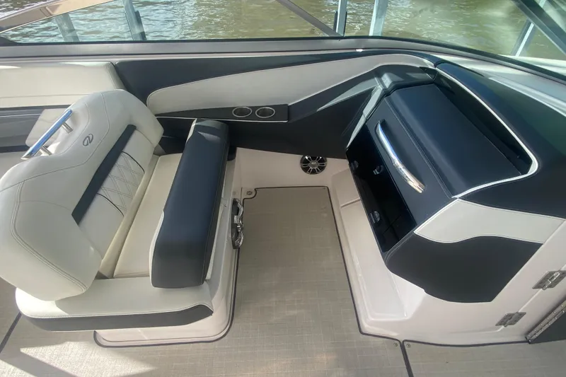 Slide: The Image of 2021 Regal 3300 Bowrider interior with sleek seating and modern dashboard design. - 17
