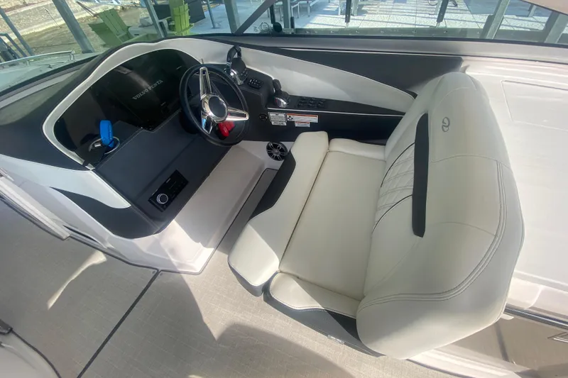 Slide: The Image of 2021 Regal 3300 Bowrider helm with modern steering and plush seating. - 20
