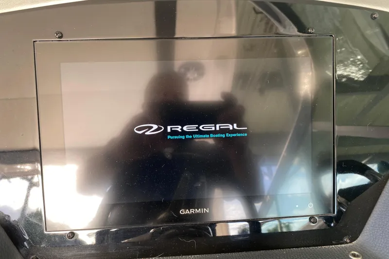 Slide: The Image of Garmin display on 2021 Regal 3300 Bowrider boat, showing Regal logo. - 25