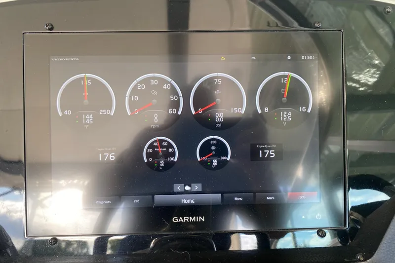 Slide: The Image of Garmin display on 2021 Regal 3300 Bowrider showing engine metrics and gauges. - 26